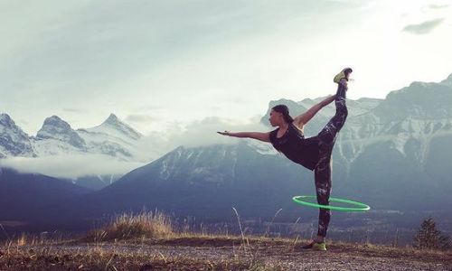 Picture of Marika Sila performing a stunt in between mountains